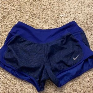 Black and dark blue patterned Nike running shorts